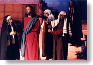 Jesus being accused by two Scribes and one Pharisee.