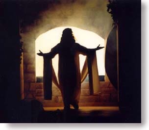 An image of Jesus silhouetted in front of the open tomb.