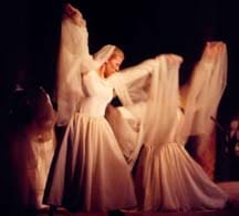 Women, dressed in flowing white outfits, dancing as Angels who minister to Jesus at His death for us all. 