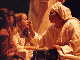 Applying makeup to a child actor in this dramatic Easter pageant play.