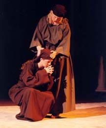 Two women, dressed in Bible costumes depicting Mary and Martha grieving the death of their brother.