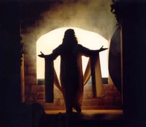 Jesus, silhouetted by the open tomb.