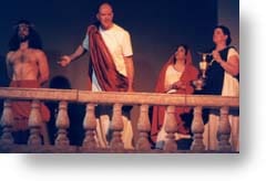 Pilate on the porch, motioning to Jesus.