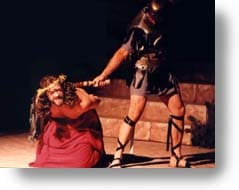 A Roman Solder beating Jesus.