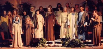 A group of singers, in Bible costumes, with Keith Ward playing his clarinet.
